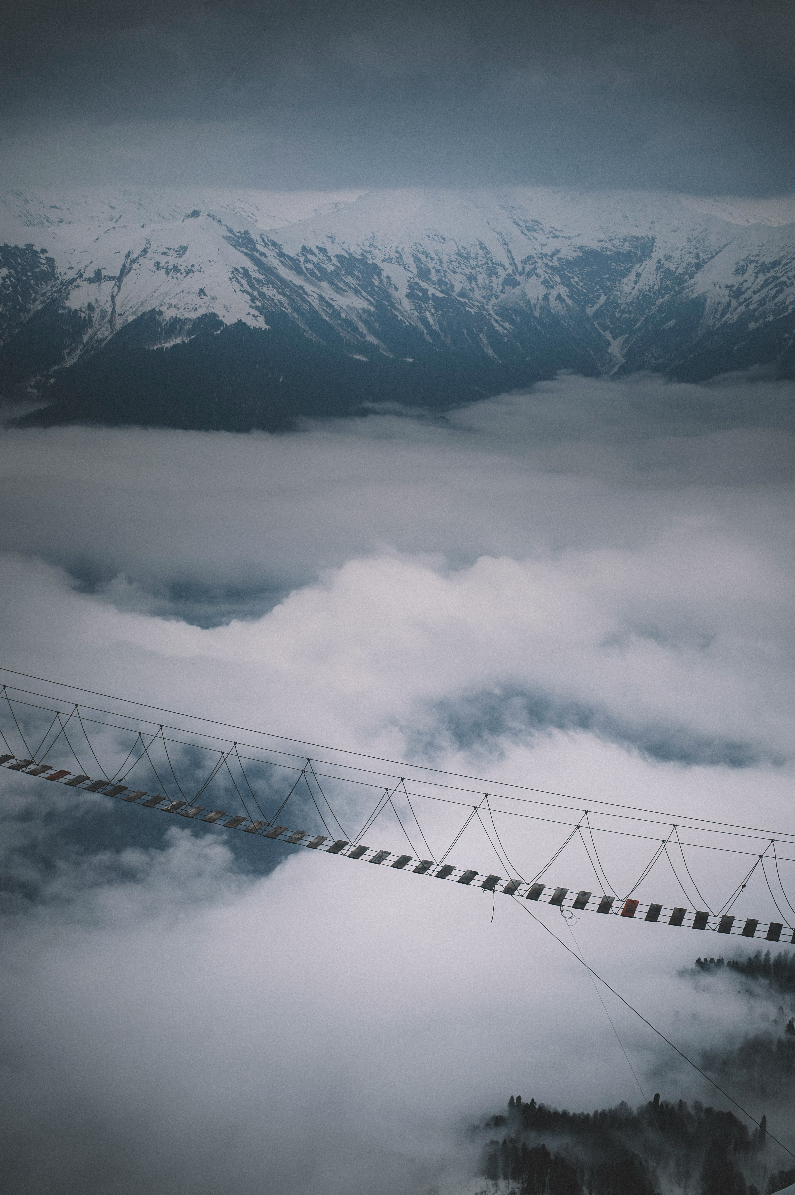 white clouds over snow covered mountain